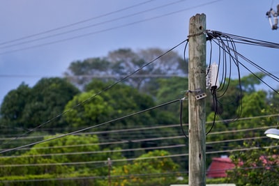 Iron wire during the brown wooden poles
